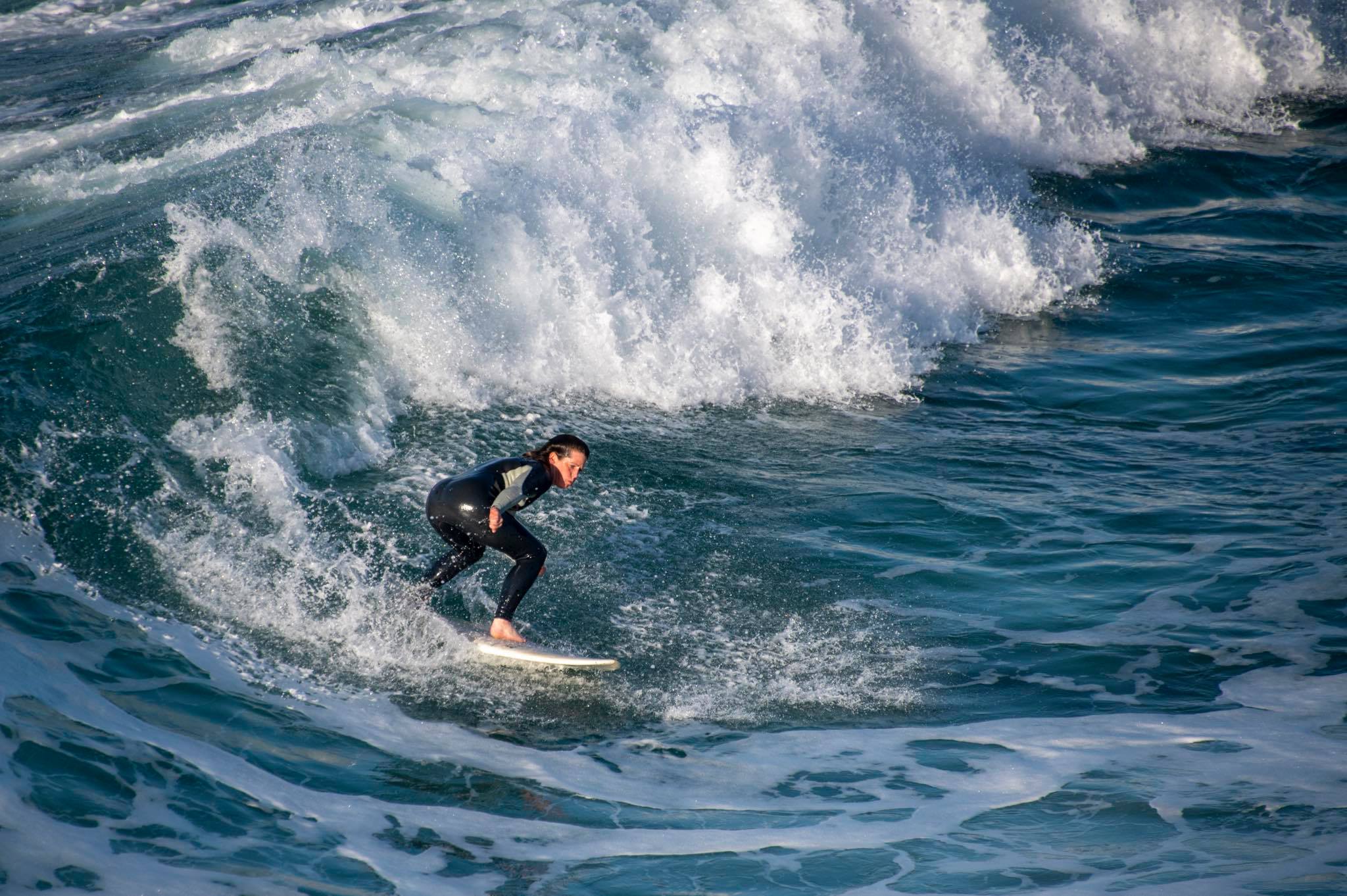 female surfer on a wave