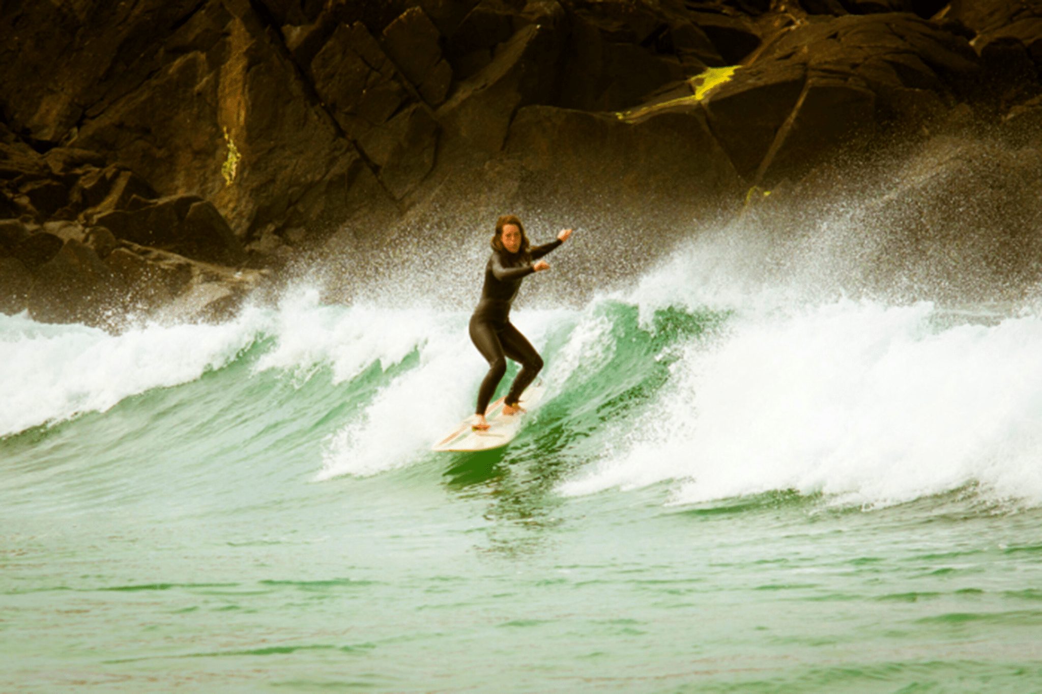 woman surfing a wave 